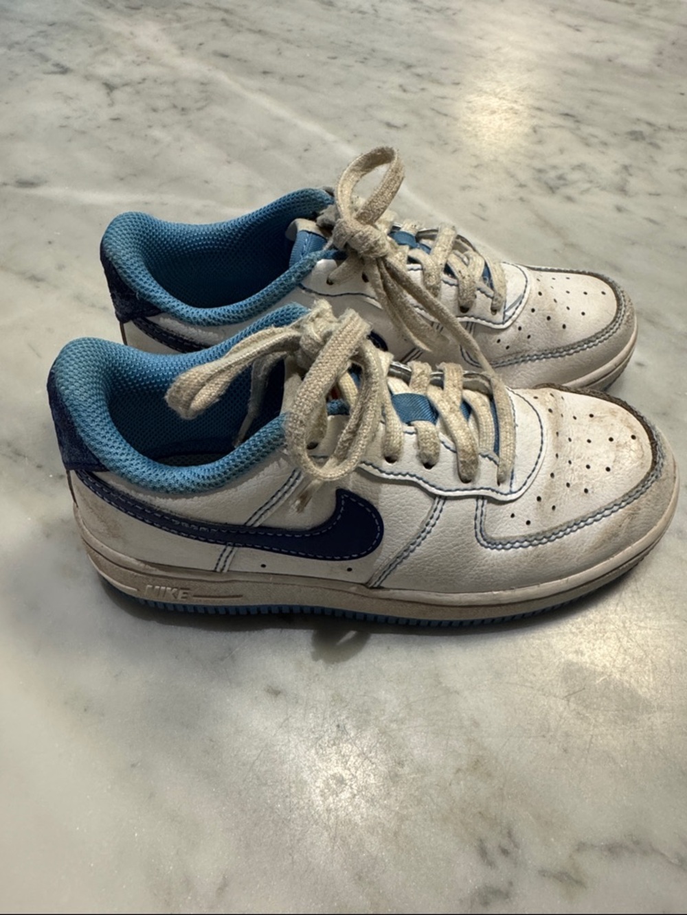 Nike Kids White Sneakers with Light Blue and Navy Swoosh